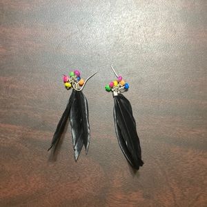 Feather and bead earrings.